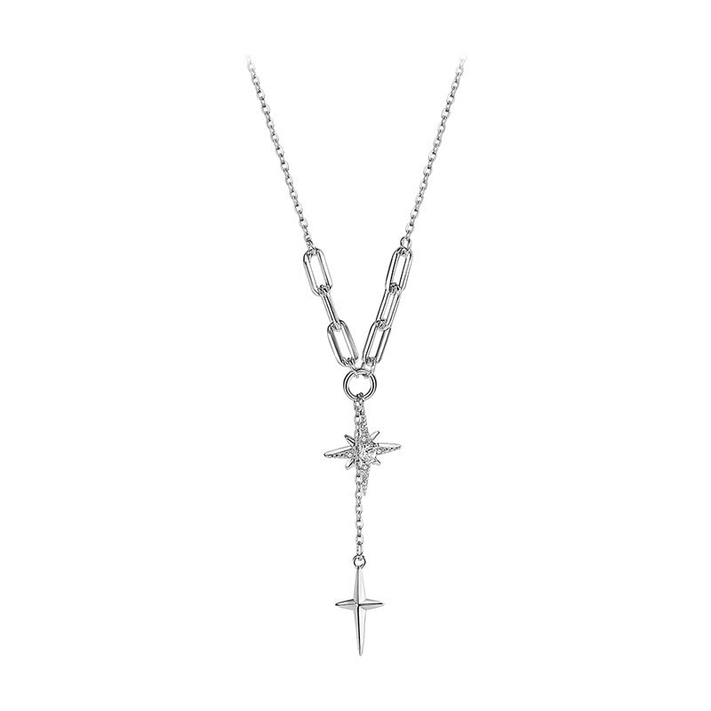 Dual north star lariat necklace worn on model close-up