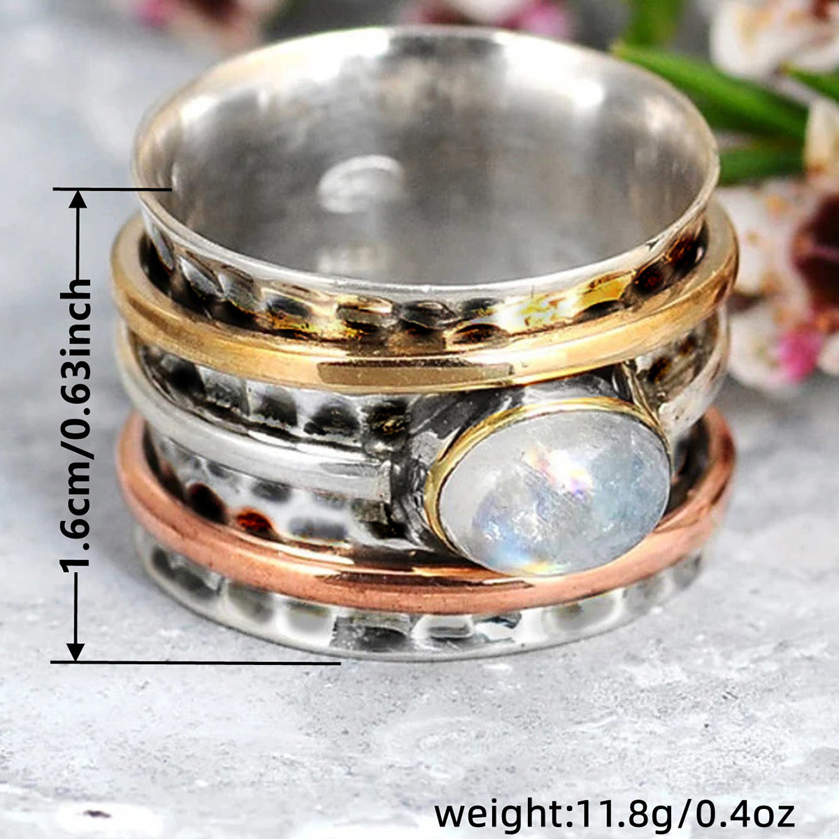 Moonstone spinner ring dimensions infographic showing 1.6cm band width and 11.8g weight