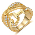Gold CZ multi-band OT buckle ring worn on model hand lifestyle shot