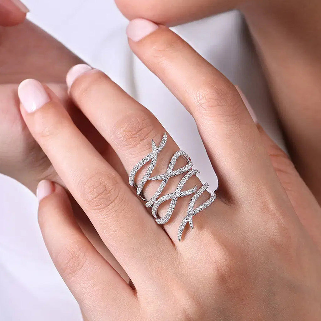 CZ pavé feather wrap statement ring worn on model hand